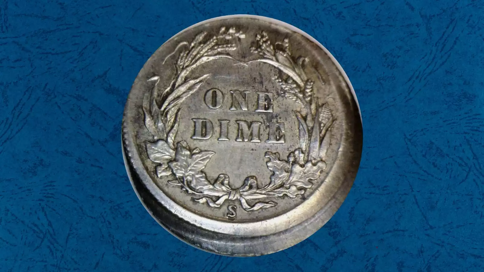 1913 Barber dime off-center strike error showing crescent-shaped blank area and shifted Liberty design